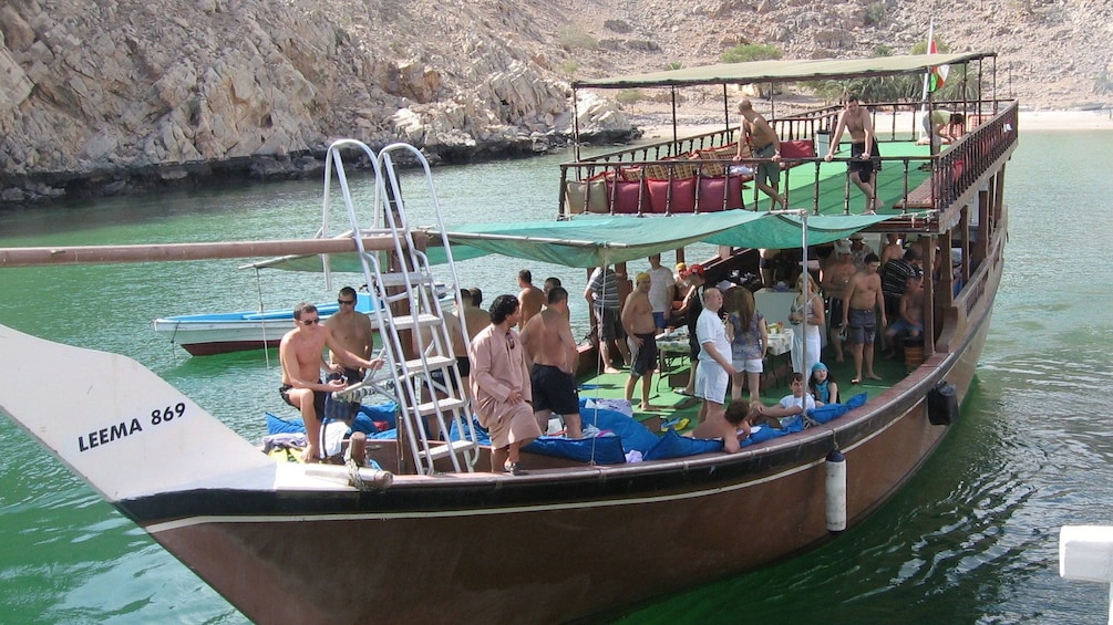 Tourists board a cruise boat in the Indian Ocean