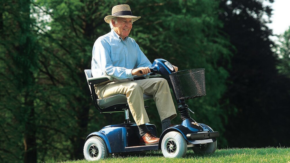 Gentleman riding the pedestrian scooter