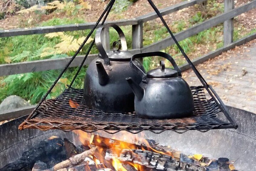 Herbal drink by open fire