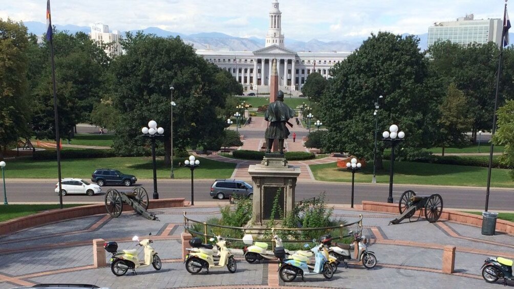 Scooters parked near statue at capital building in Denver