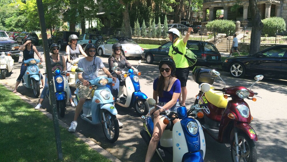 Tour group ready to embark on a scooter tour