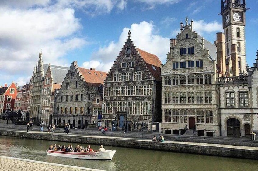 Guides together enjoy the splendor of Ghent: the Graslei.