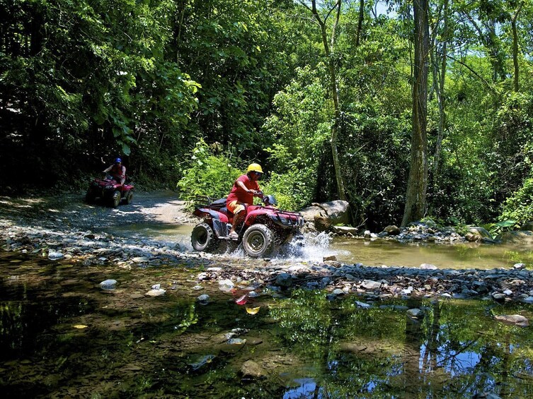 ATVing through rain pools 