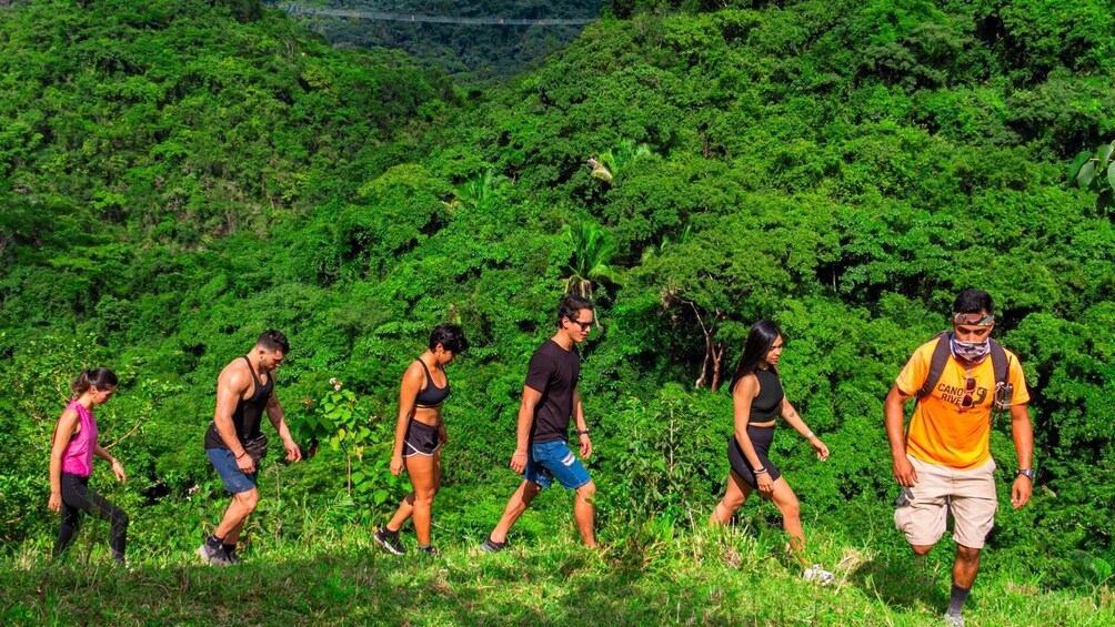 Hiking group makes its way up hill 