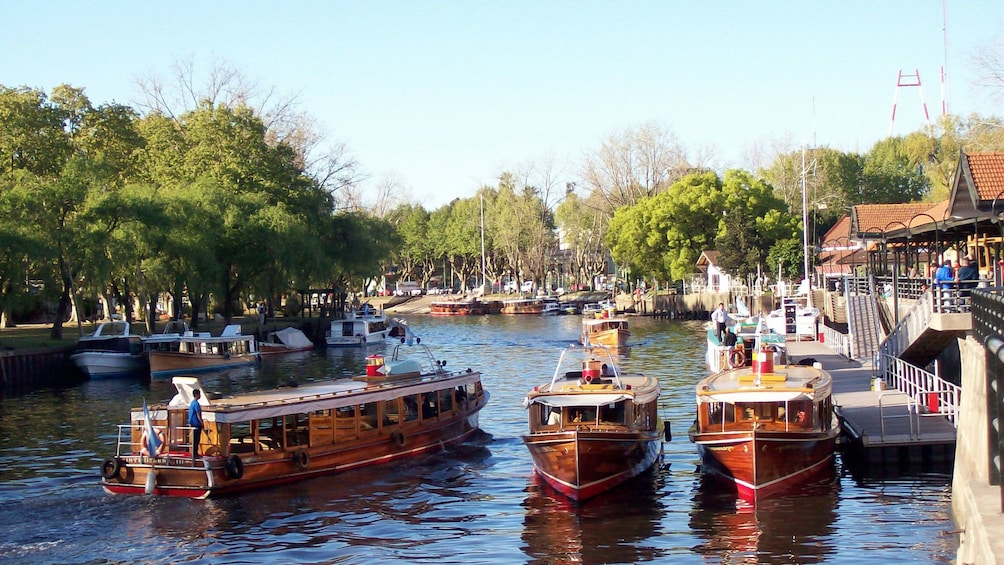 three small boats along the channel in Argentina