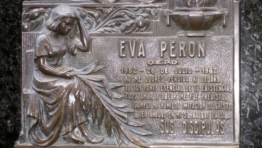 a plaque of Evita Peron on the wall in Argentina