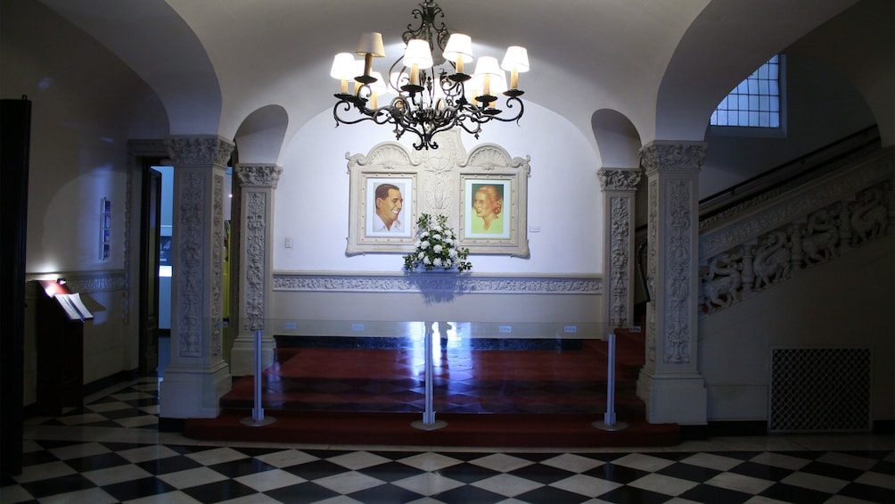 Paintings of Evita and Juan Peron in the great halls of a building in Argentina