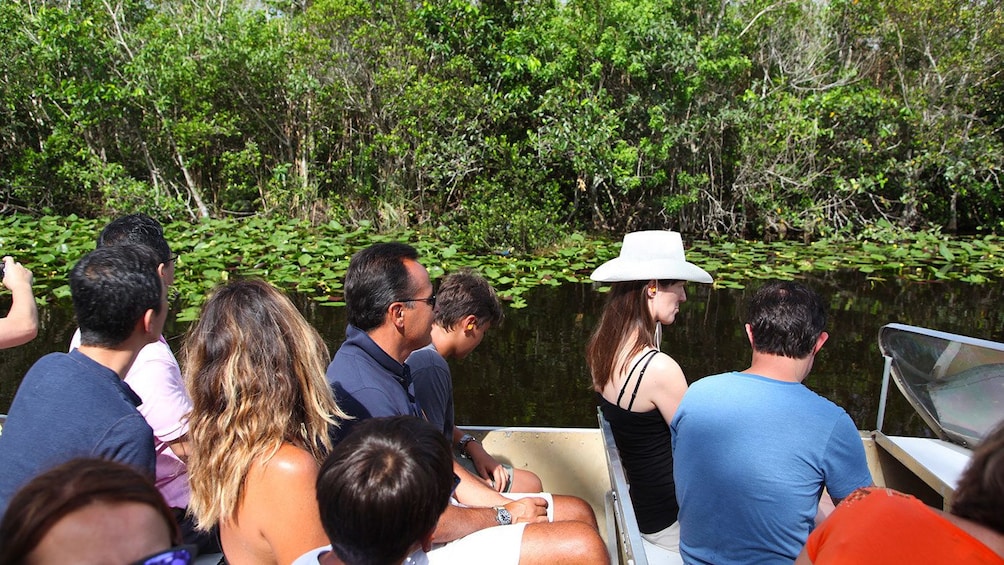 passengers on a small boat in Miami