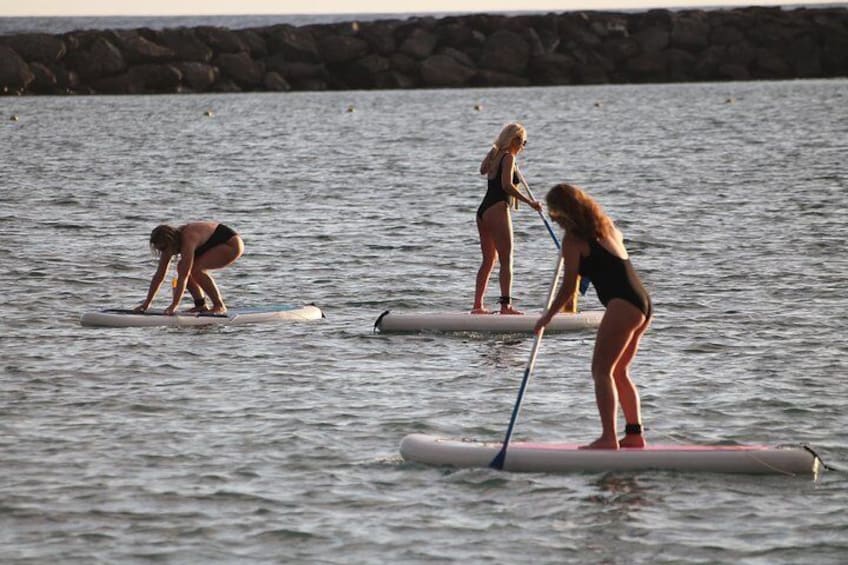sunset stand up paddle