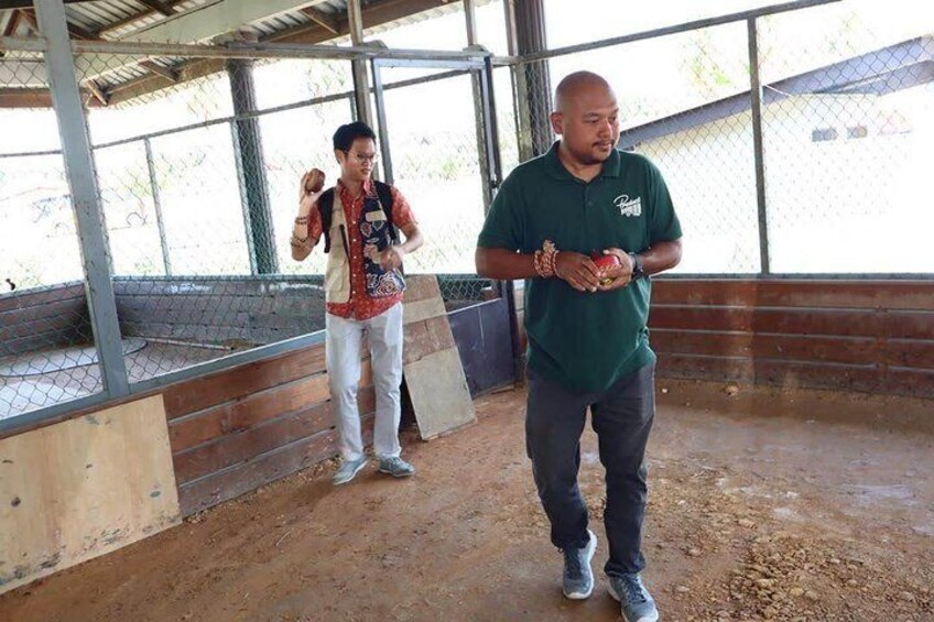Participant practicing how to throw the top