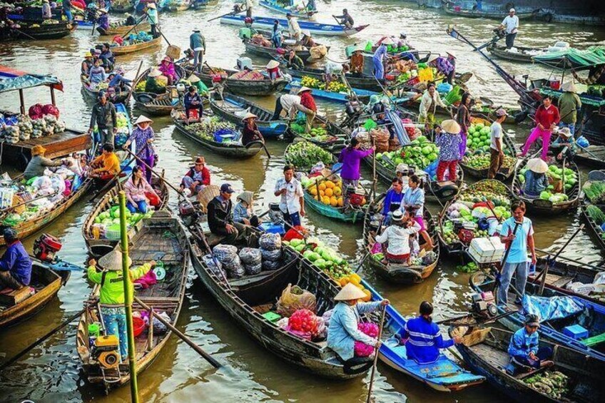 Floating markets, a unique cultural aspect of Vietnamese people in the Mekong Delta, are held directly on the river.