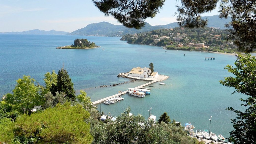 Show item 1 of 5. Vlacherna Monastery on the water with a small island nearby on Corfu