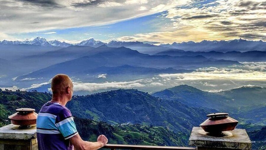 Tourist enjoying beautiful panoramic view of the mountains from Nagarkot
