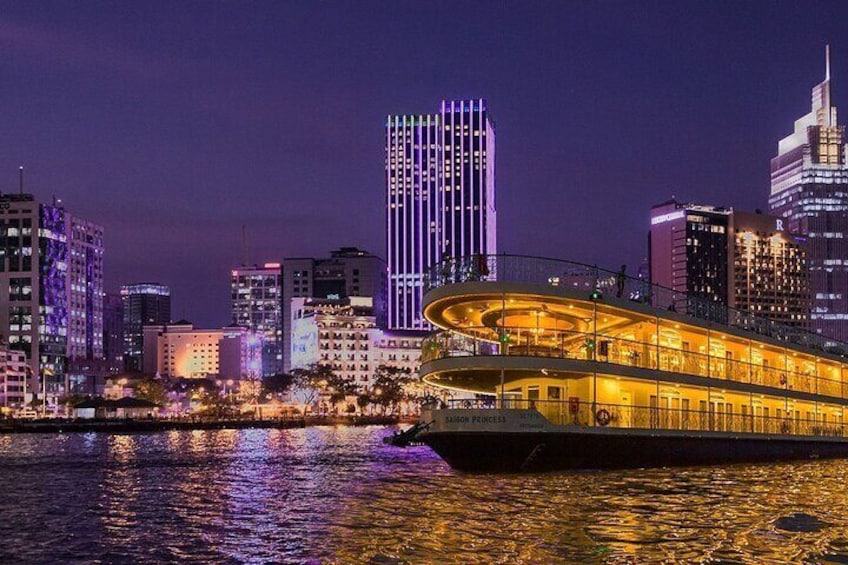 Enjoy a cruise with stunning views of the Saigon River in the evening.