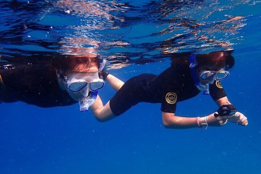 Snorkelers taking photos during the excursion