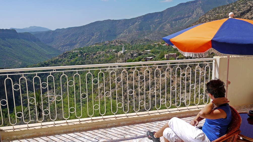 Woman on a balcony enjoying a panoramic view of Paradise Valley