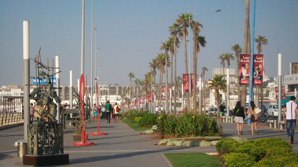 city street lined with palm trees 