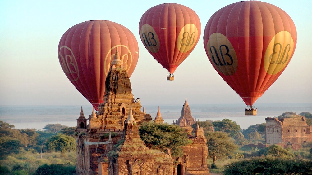 Stunning view of three hot air balloons floating over Bagan 