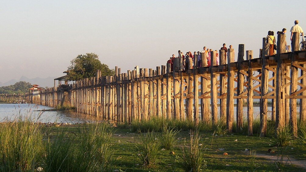 Day view of people on the U Bein Bridge in Mandalay 