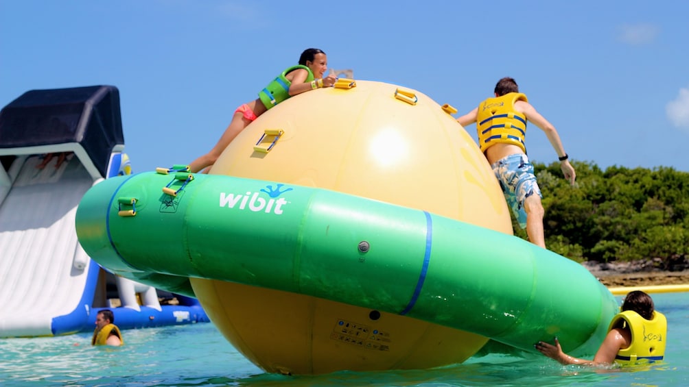 Kids frolic on a huge WiBit inflatable ball