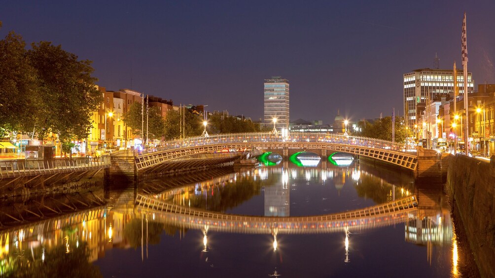 Bridge and city lit up at night in Dublin