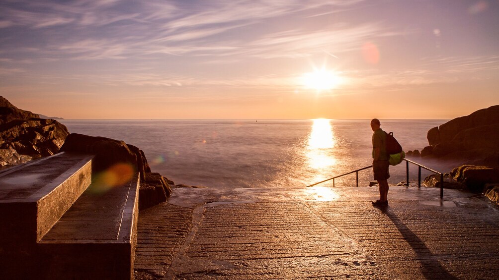 Beautiful sunset view of a tourist near the waters of Dublin on a clear day 