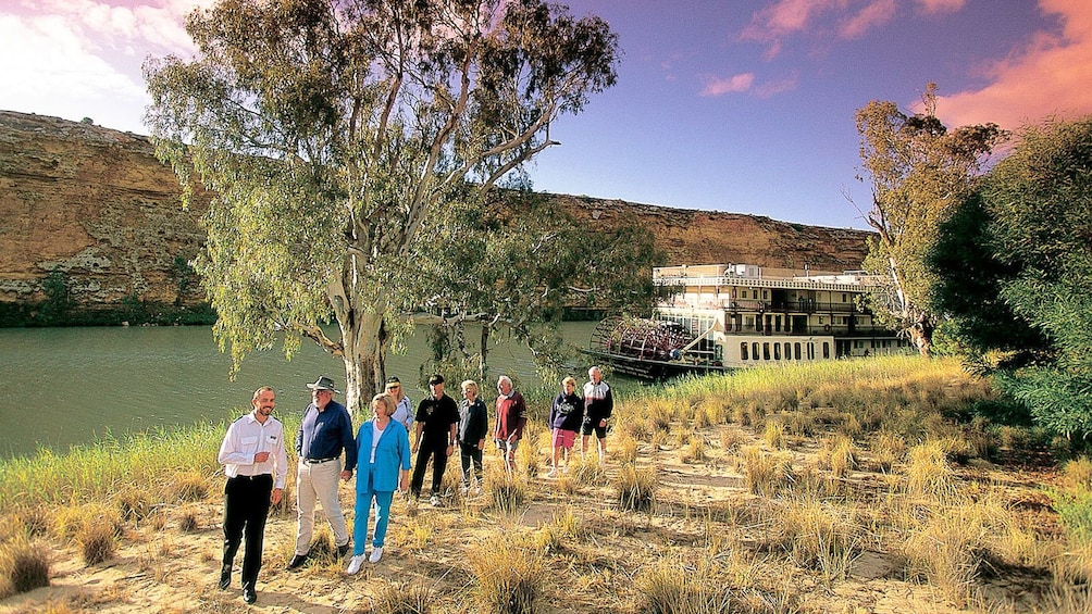 Show item 2 of 5. ferry passengers walking on land in Australia