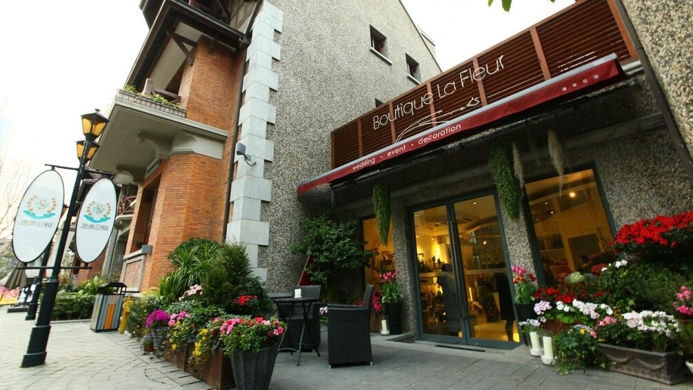 potted plants outside a small boutique in Shanghai