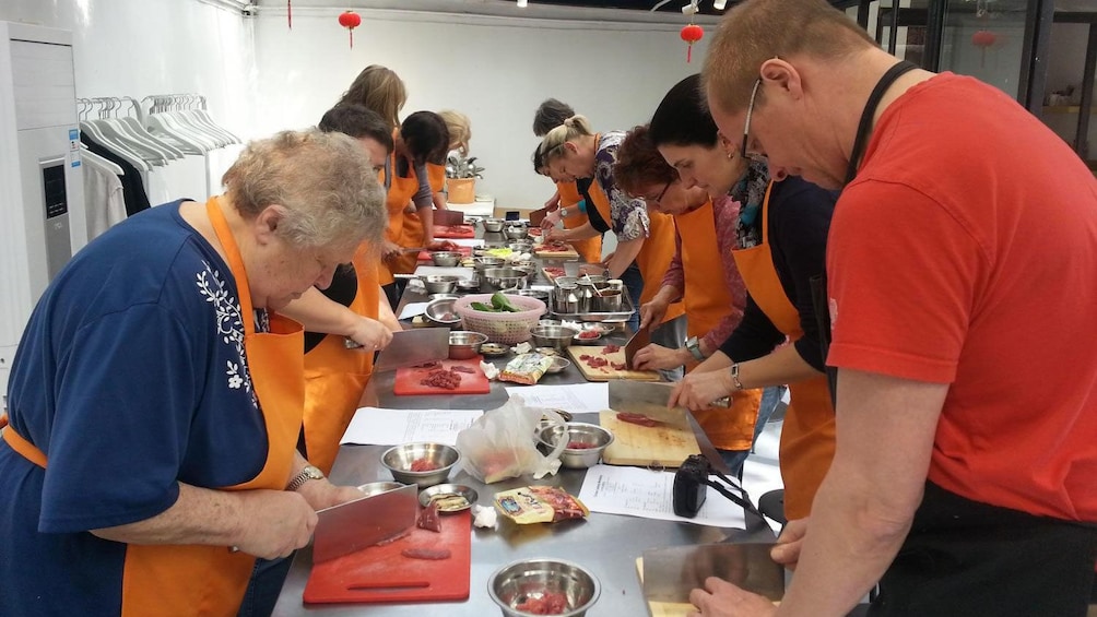 cooking class participants preparing ingredients in Shanghai