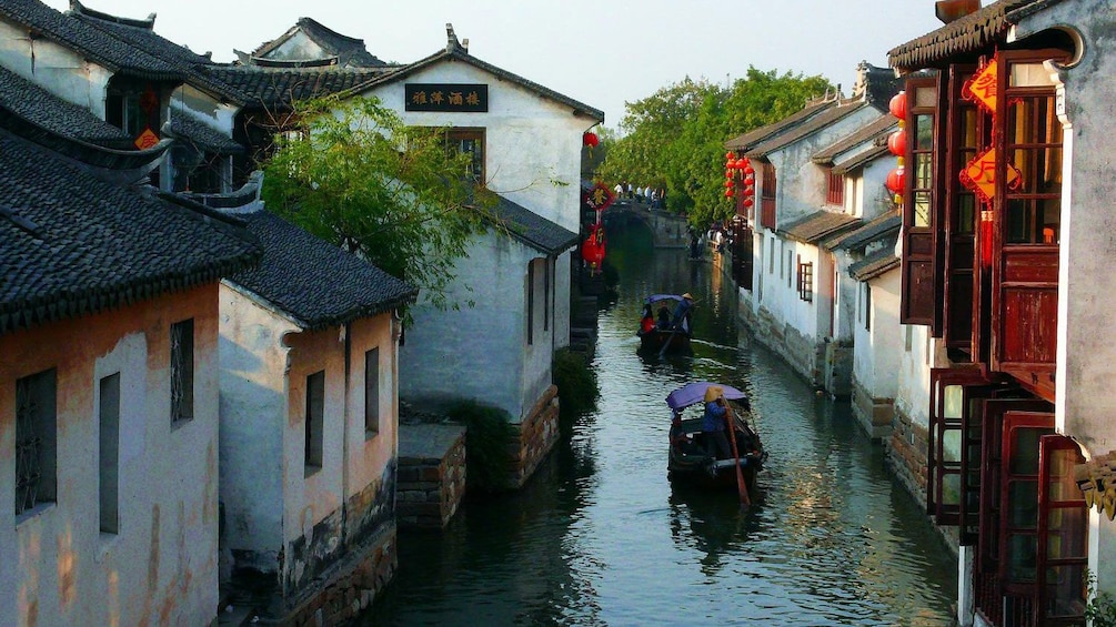 canal lined with buildings in Suzhou, China