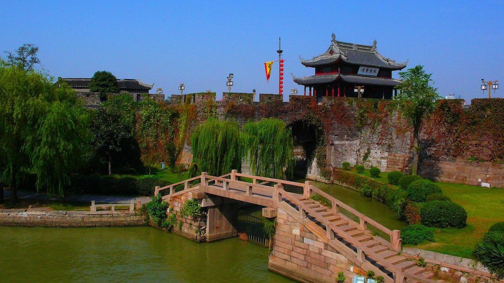 Show item 4 of 9. small gate underneath a water bridge in China