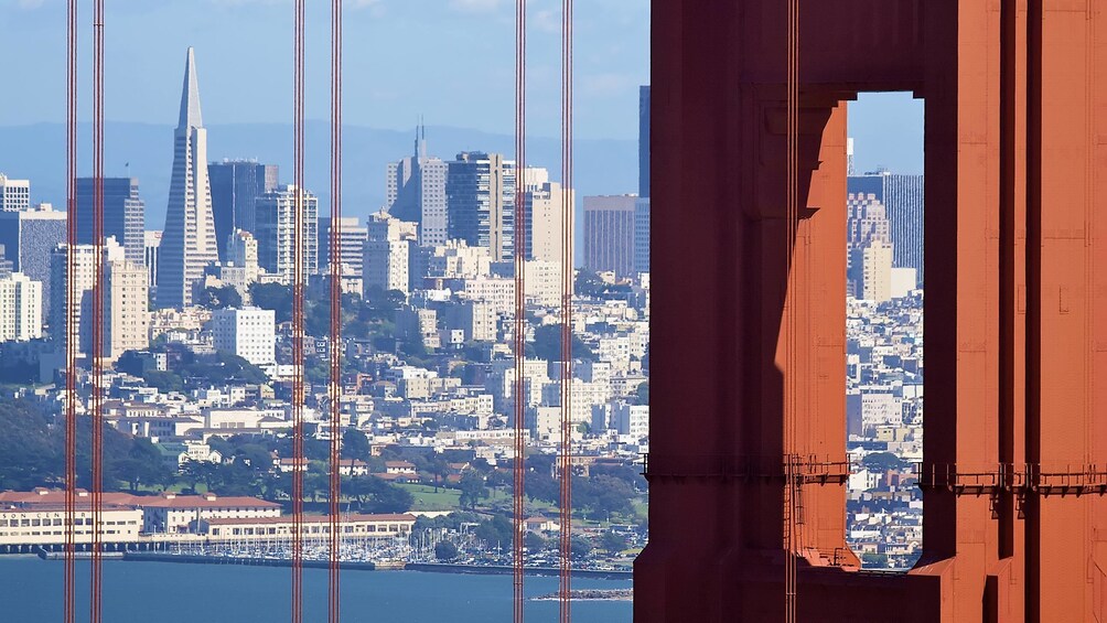 Close view of the Golden Gate Bridge with the cityscape in the background in San Francisco 
