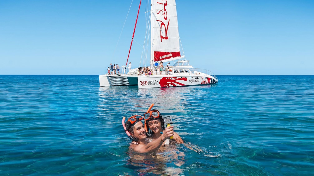 Couple snorkeling on the catamaran cruise in Ochos RIos 