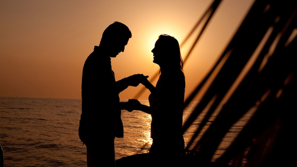 Couple dancing aboard the Sunset Catamaran Cruise in Negril