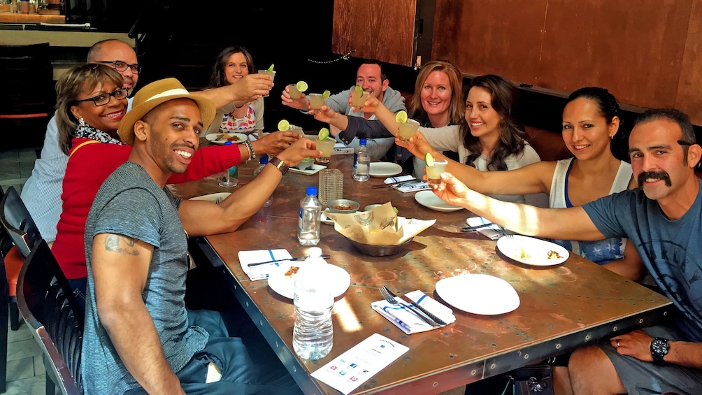 Group dining and drinking on the Original Downtown Food Tour by Taste Santa Barbara Food Tours