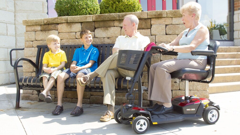 elderly woman accompanying grandsons in Orlando