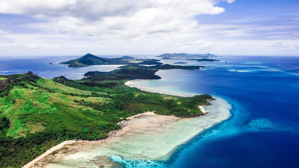 Show item 1 of 5. aerial view of island and beach in fiji