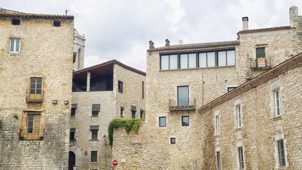 strolling by the old stone town buildings in Barcelona