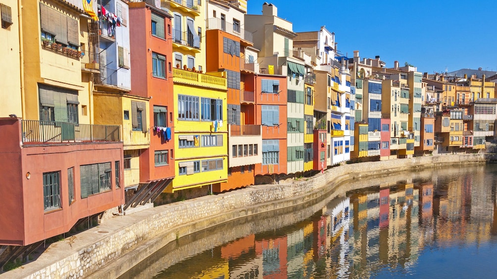 vibrant colored building units along the water channel in Barcelona