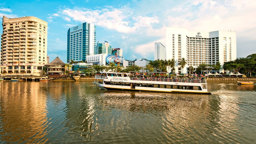 Stunning day view of the boat floating on the Sarawak River Sunset Cruise 