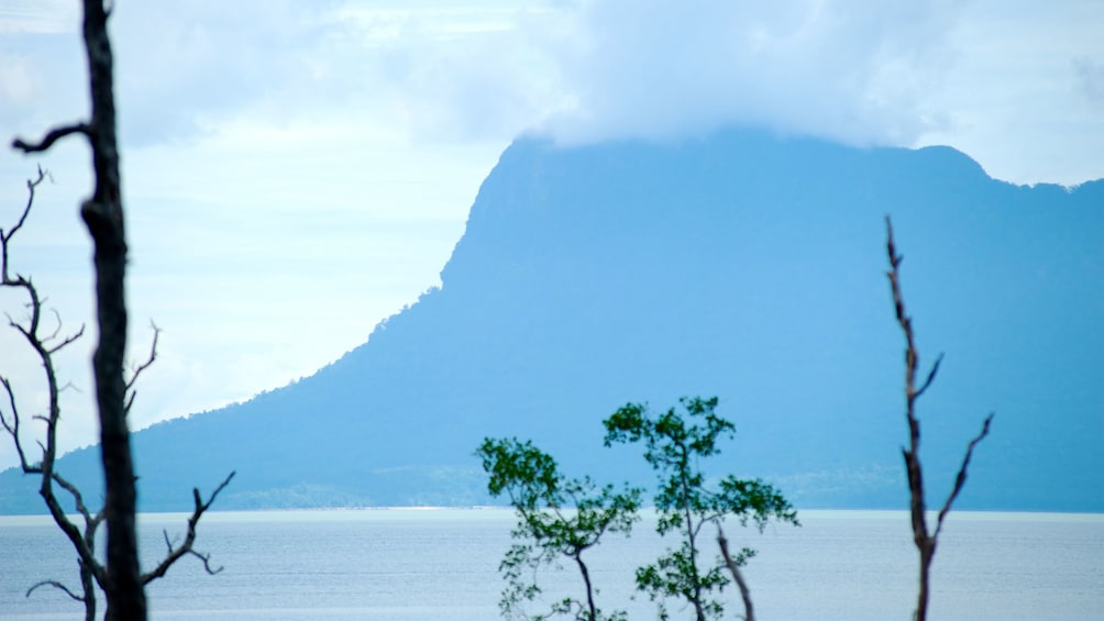 Serene view of the water and mountain at the Sarawak Cultural Village in Malaysia 