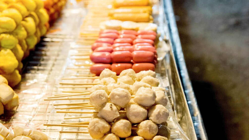 meatballs and sausages at the street market in Thailand