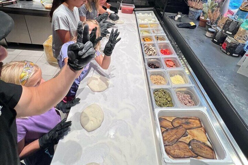 Pizza cooking experience in Pizza restaurant with Tour guide