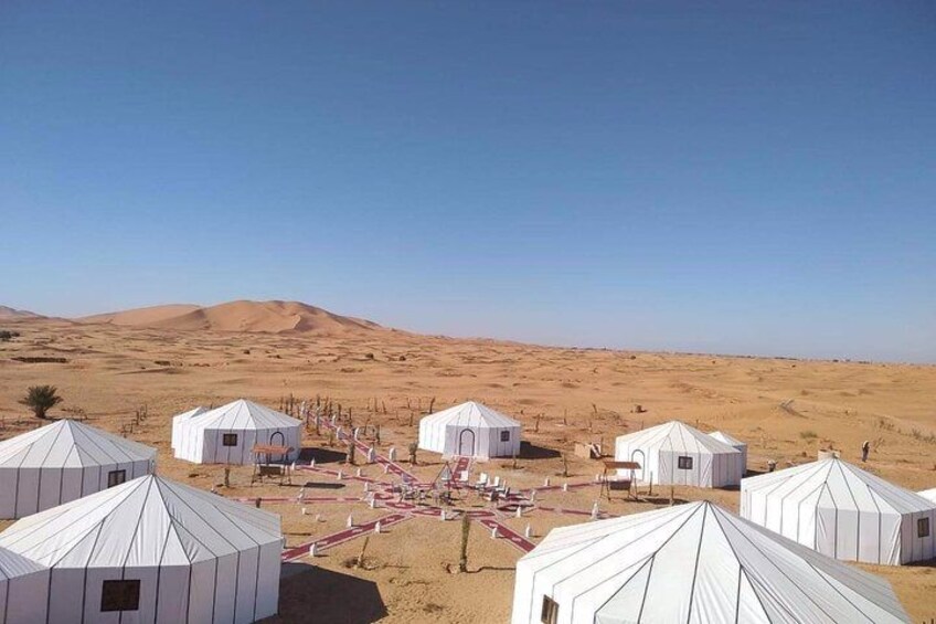 Merzouga: Overnight in Luxury Desert Camp with Camel Ride, meals & sandboarding