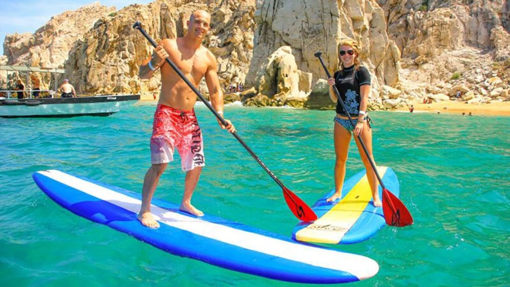 Stand up paddling couple off the coast of Los Cabos