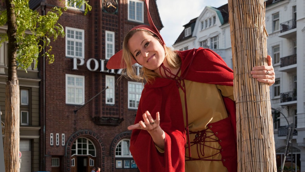 Tour guide in red and yellow costume in hamburg