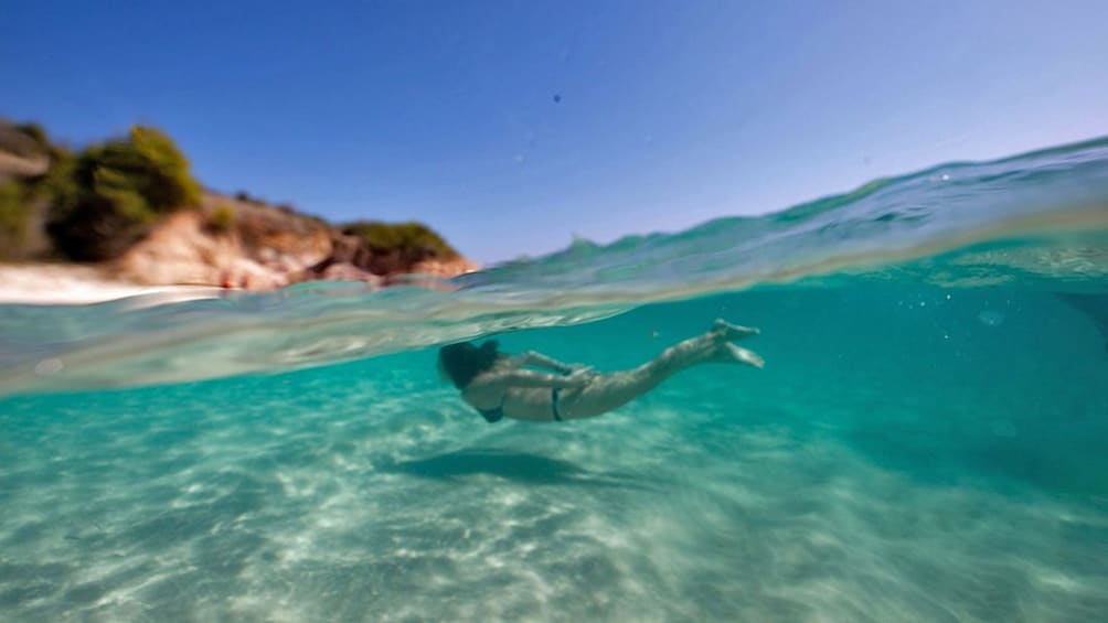 woman swimming in antigua