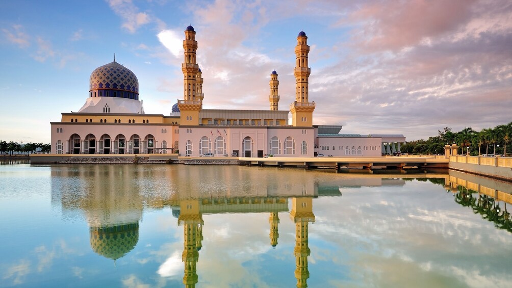 the city mosque reflecting from the water in Kota Kinabalu