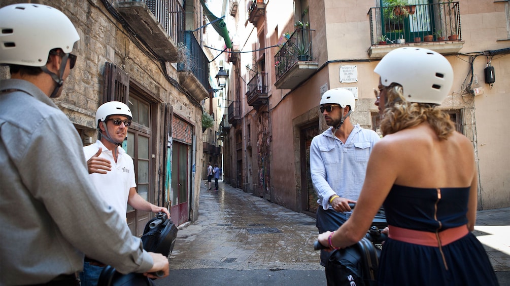 group looking for directions while traveling on segways in Barcelona