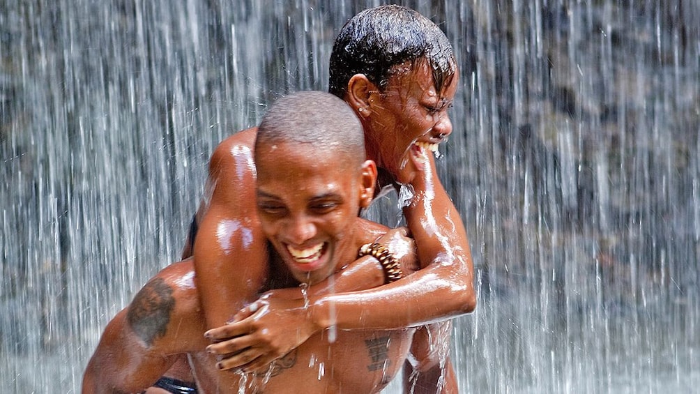 couple in waterfall in St Lucia